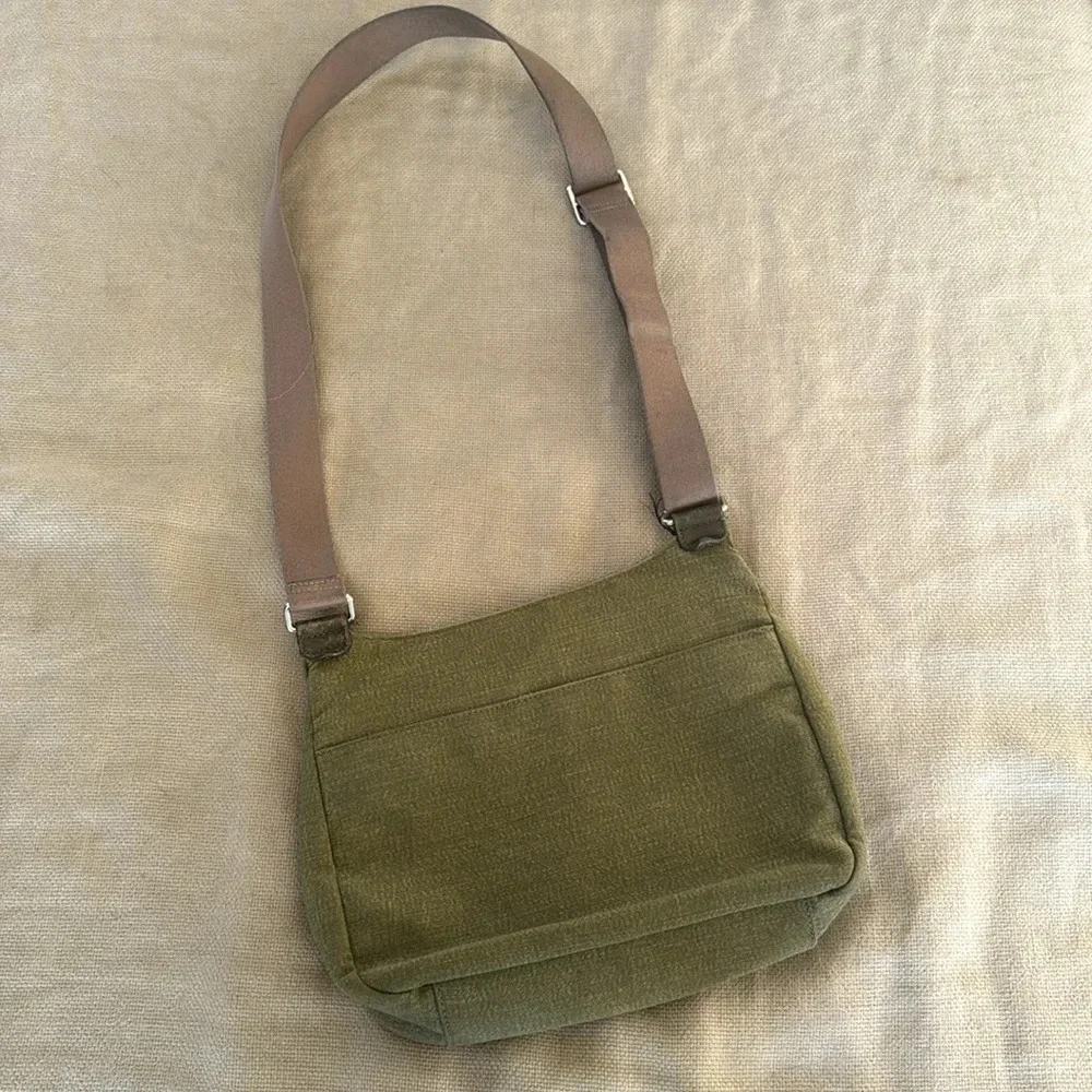 Kipling moss green with colbalt blue lining crossbody bag